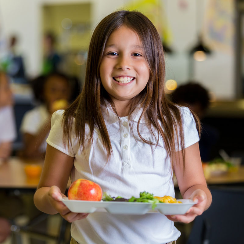 girl holding lunch tray